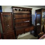 GOOD QUALITY REPRODUCTION OAK AND MAHOGANY BANDED DRESSER, THE TOP FITTED WITH THREE SHELVES WITH