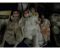 FOUR PORCELAIN DOLLS