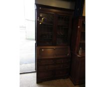 EARLY 20TH CENTURY OAK BUREAU BOOKCASE WITH TWO LEADED DOORS WITH DROP FRONT WITH GEOMETRIC DRAWER