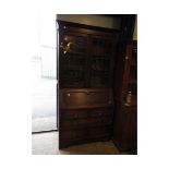 EARLY 20TH CENTURY OAK BUREAU BOOKCASE WITH TWO LEADED DOORS WITH DROP FRONT WITH GEOMETRIC DRAWER