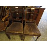 PAIR OF WALNUT FRAMED CARVED SPLAT BACK BEDROOM CHAIRS WITH BROWN UPHOLSTERED SEATS ON FLUTED