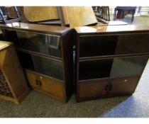 PAIR OF THREE TIER BOOKCASES, EACH WITH FOUR GLASS SLIDING DOORS OVER TWO PANELLED CUPBOARD DOORS (