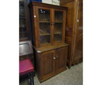 PINE FRAMED BOOKCASE WITH TWO GLAZED DOORS, THE BASE FITTED WITH TWO PANELLED DOORS