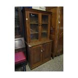 PINE FRAMED BOOKCASE WITH TWO GLAZED DOORS, THE BASE FITTED WITH TWO PANELLED DOORS