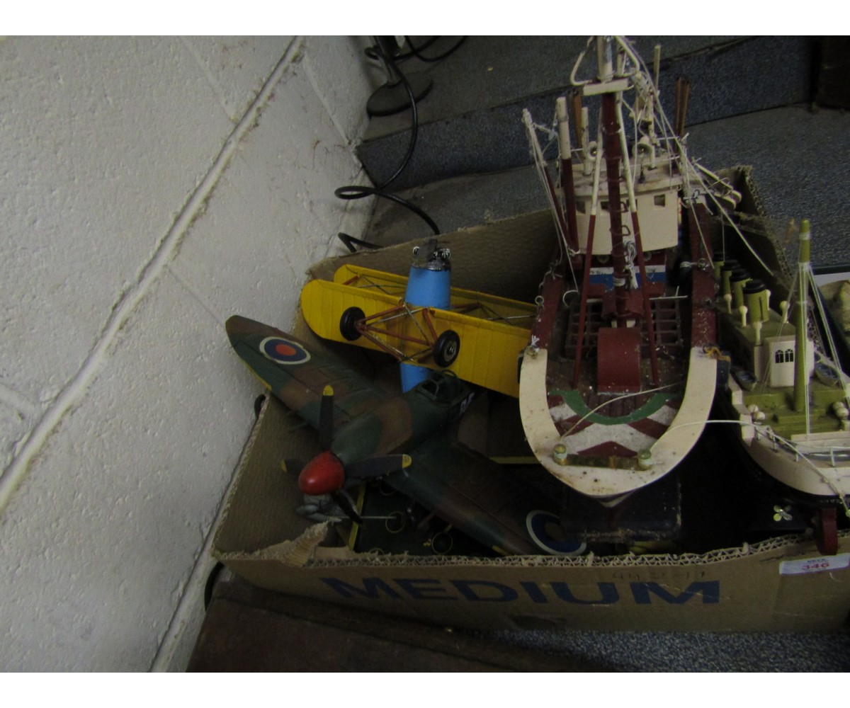 BOX CONTAINING TWO MODELS OF SHIPS, TIN PLATE SPITFIRE AND BI-PLANE