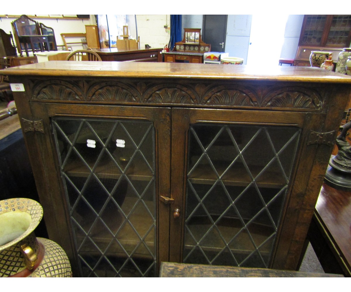 EARLY 20TH CENTURY OAK FRAMED LEADED AND GLAZED BOOKCASE WITH CARVED HALF MOON FRIEZE WITH