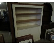 WHITE PAINTED AND PINE FRAMED BOOKCASE WITH TWO ADJUSTABLE SHELVES OVER TWO PANELLED CUPBOARD DOORS