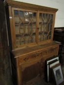 EARLY 19TH CENTURY PITCH PINE BOOKCASE WITH TWO ASTRAGAL GLAZED DOORS OVER TWO DRAWERS AND TWO