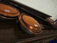 THREE COPPER WARMING PANS WITH TURNED HANDLES