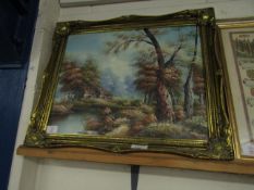 GILT FRAMED CONTINENTAL OIL ON CANVAS OF A COTTAGE LANDSCAPE SCENE