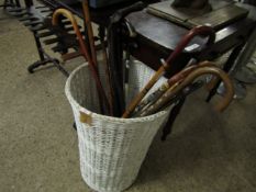 WHITE WICKER BASKET WITH A QUANTITY OF WALKING STICKS