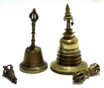 Pair of Chinese brass temple bells and two further brass carvings, one with Buddhistic deity (4)