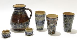 Group of 19th century Doulton stoneware items including a large jug, 3 beakers with typical