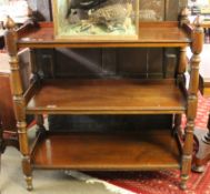 Late 19th/early 20th century mahogany three tier buffet, the four columns crested with corners
