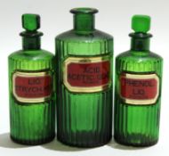 Group of green glass apothecary bottles, the reeded bodies with an inset "poison" label