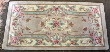 Small Chinese or Indian rug with typical floral decoration, 62 x 122cm