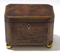 Mid 19th century grained mahogany caddy with inlay and ivory escutcheon, the caddy raised on four