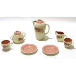 Group of Susie Cooper wares comprising a coffee pot and cover, sugar bowl and milk jug, 2 cups and