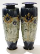 Pair of early 20th century Royal Doulton Art Nouveau style vases with a tube lined floral design