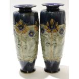 Pair of early 20th century Royal Doulton Art Nouveau style vases with a tube lined floral design
