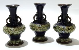 Group of three mid-20th century Royal Doulton vases with a tube lined floral design to base and