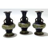 Group of three mid-20th century Royal Doulton vases with a tube lined floral design to base and