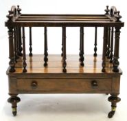 Victorian walnut Canterbury, the top applied with carry handles and with three sections over a