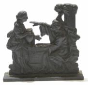 Metal door stop with two religious figures