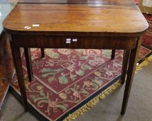 Early 19th century mahogany card table with fold-top over a plain frieze and raised on tapering