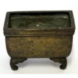 Chinese bronze censer on four scroll feet decorated with geometric motifs amongst ruyi, 13cm long