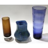 Group of three Art glass vases, one with a swirling blue green design, the other with a brown