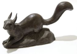 Spelter model of a squirrel on leafy base, 27cm long