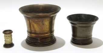 Two bronze mortars and a small ivory cylindrical carved vase, largest mortar 14cm high