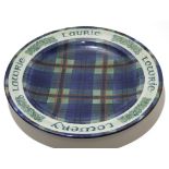 Scottish Tain Pottery charger signed by Alan Powell, with a Laurie or Lowrie tartan design to front,