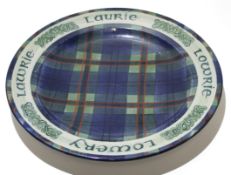 Scottish Tain Pottery charger signed by Alan Powell, with a Laurie or Lowrie tartan design to front,