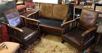 Early 20th century oak framed three piece suite all with adjustable backs, the sides with small cane