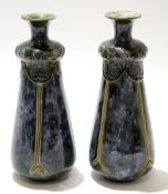 Pair of early 20th century Royal Doulton vases with tube lined Art Nouveau floral design on a