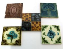 Collection of fourteen Victorian glazed pottery tiles including two Minton tiles with an Art Nouveau