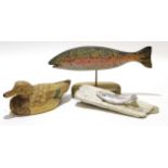 Group of three wooden carvings, one of a duck with naturalistic feathers and two carvings of fish
