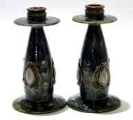 Pair of early 20th century Royal Doulton stoneware candlesticks in an Art Nouveau shape with tube