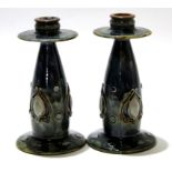 Pair of early 20th century Royal Doulton stoneware candlesticks in an Art Nouveau shape with tube