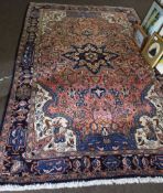 Modern Caucasian wool carpet, central floral rosette and triple gull border mainly shaded blue and