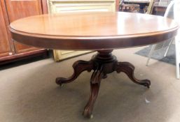 Victorian mahogany pedestal dining table, with oval tilt top to a turned baulster column and