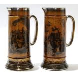 Pair of Ridgways treacle glazed jugs with decoration from Mr Pickwick, within silver coloured