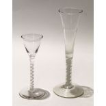 Wine glass with funnel bowl and air twist stem, together with a taller glass with air twist,