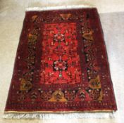 Modern Caucasian style wool carpet, multi-gulled border, central panel of floral designs, mainly