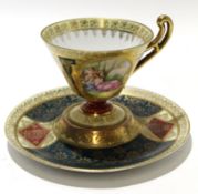 Vienna style cup and saucer decorated in gilt with a panel depicting a classical scene