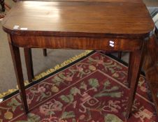 Early 19th century mahogany fold-top card table, plain frieze raised on tapering supports, 92cm