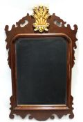 Set of four mahogany reproduction Chippendale style wall mirrors, each crested with gilded panels of