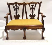 Reproduction carved hardwood miniature two-seater settee in Chippendale style with double chair